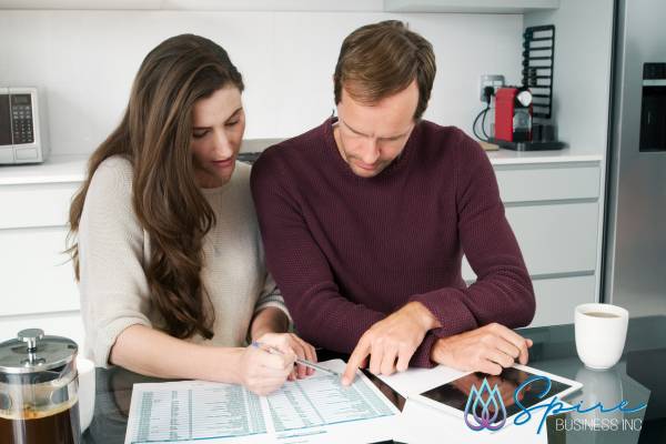 Couple reviewing business and personal financials